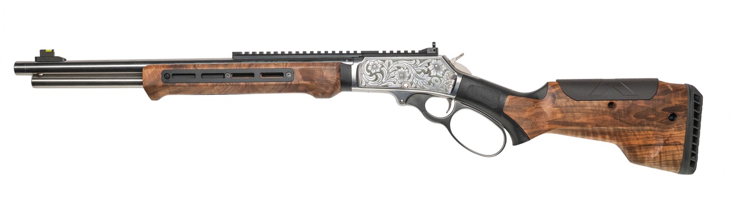 Engraved stainless lever-action rifle with walnut stock and threaded barrel, left side view