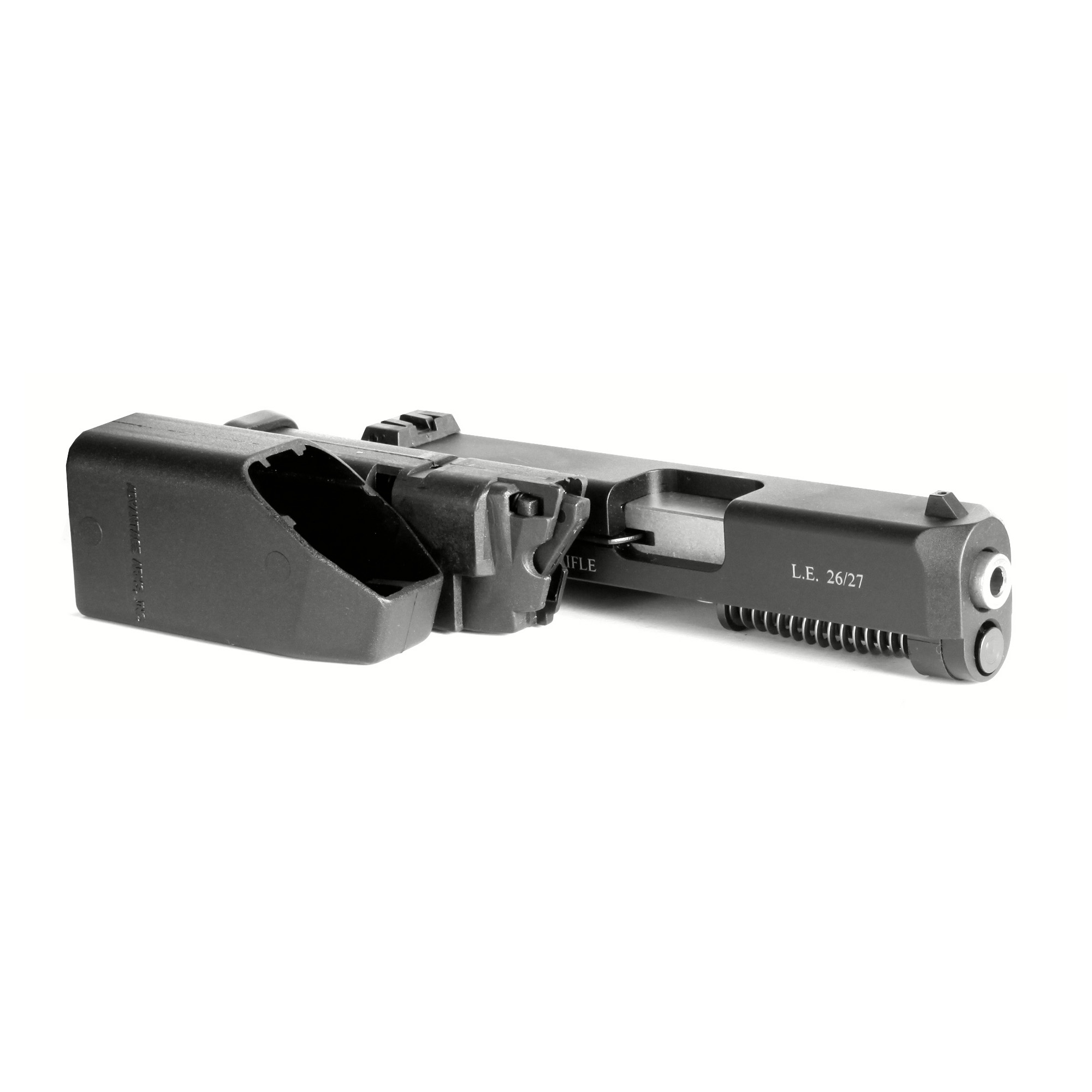 Advantage Arms conversion slide and barrel assembly with L.E. 26/27 marking next to a black magazine