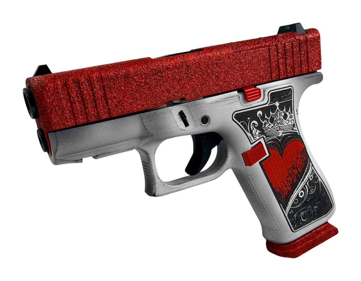 Angled view of Glock 43X 9mm pistol with red slide and silver frame showing grip design