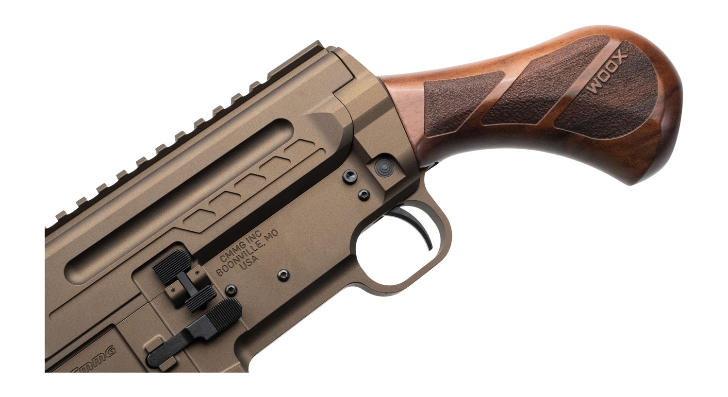 Close-up of CMMG Dissent BR4 wood grip, trigger guard and bronze receiver