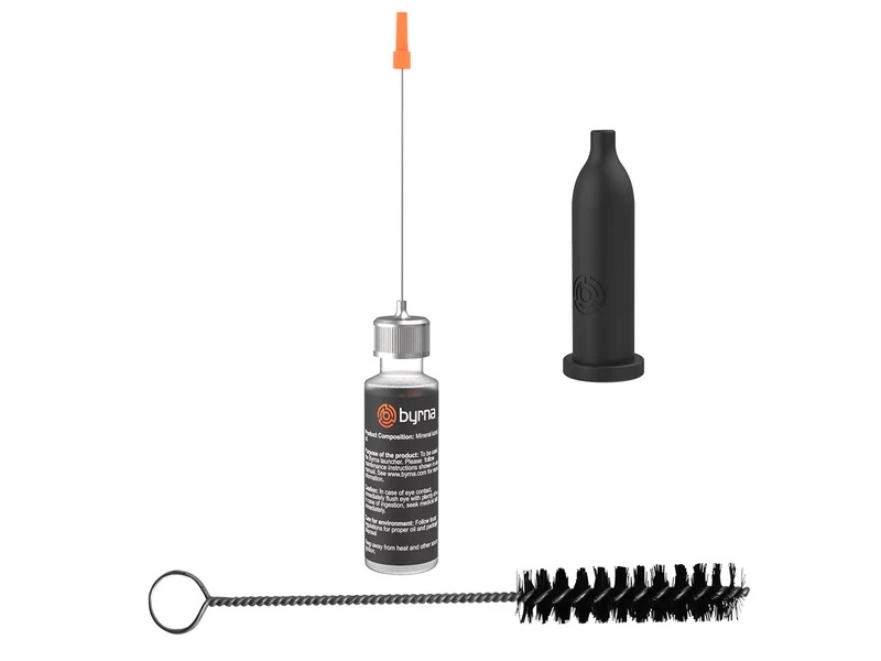 Byrna oiler kit with oil bottle, needle applicator tip, black storage cap and cleaning brush