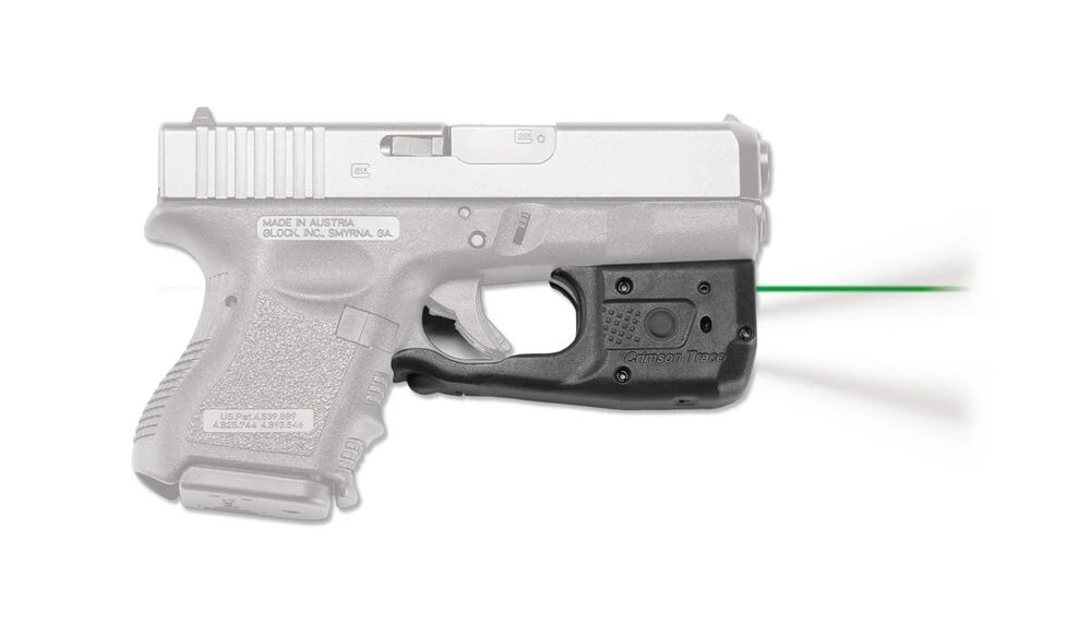 Crimson Trace LaserGuard Pro black accessory with green laser mounted on a Glock pistol