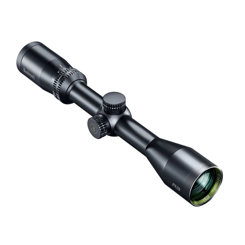 Black Bushnell R3 riflescope shown at an angle, with turret knobs and green-coated objective lens visible